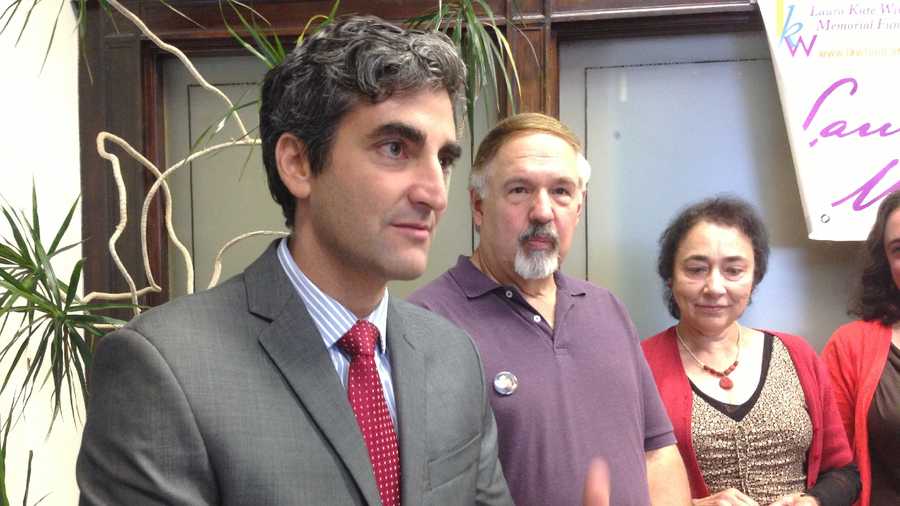 Mayor Miro Weinberger stands with Laura Winterbottom's parents, Ned and JoAnn. Laura, who would have been 40 today, was murdered in 2005. Weinberger is urging public participation in Saturday's charity walk/run to raise money for trio of causes Laura admired.