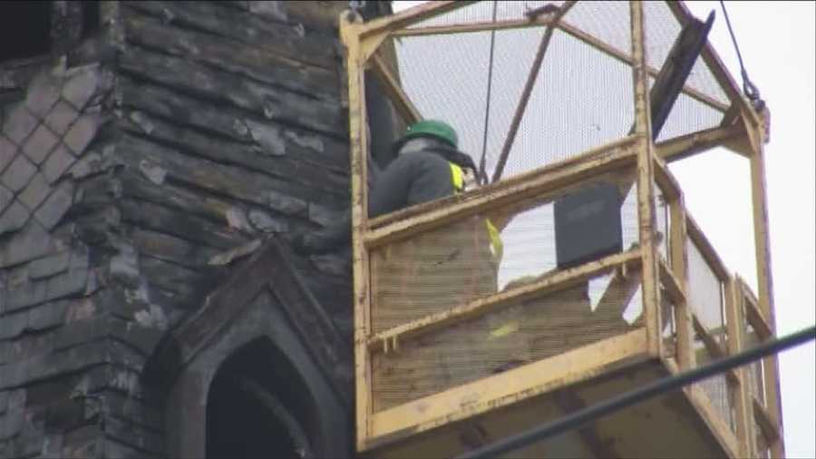 Crews dismantle steeple
