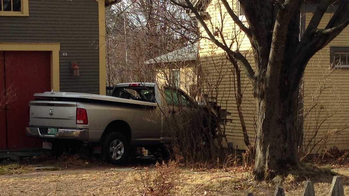 PHOTOS: Truck crashes into Colchester home