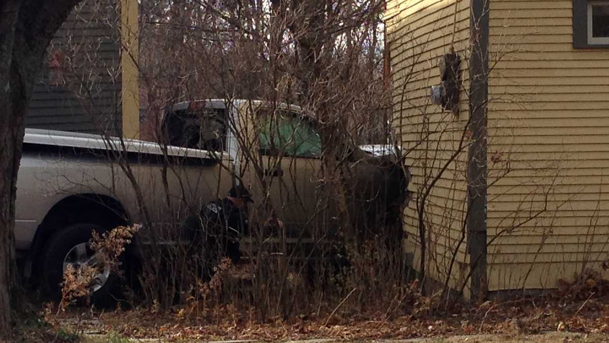 PHOTOS: Truck crashes into Colchester home