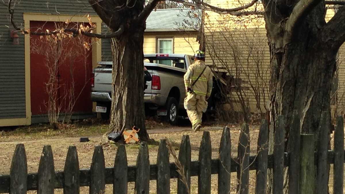 PHOTOS: Truck crashes into Colchester home