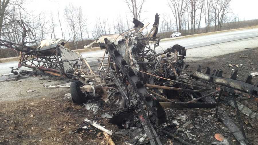 Burned out remains of a plane that crashed on Interstate 89 Friday afternoon in Highgate, Vt.
