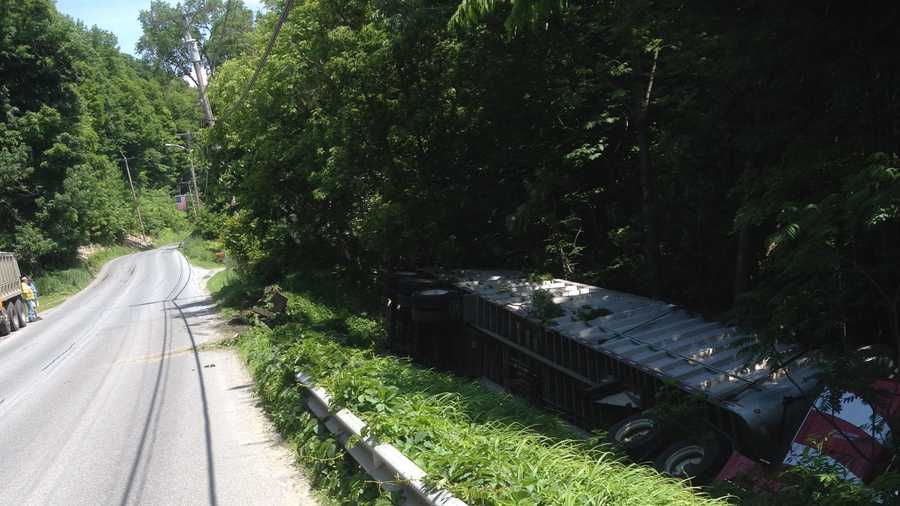 A tractor-trailer crashed through a guardrail on East Street in Bristol and rolled over Tuesday afternoon.
