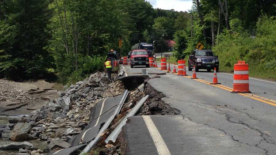 A road was washed out July 28, 2014, by flooding in Chester, Vt.