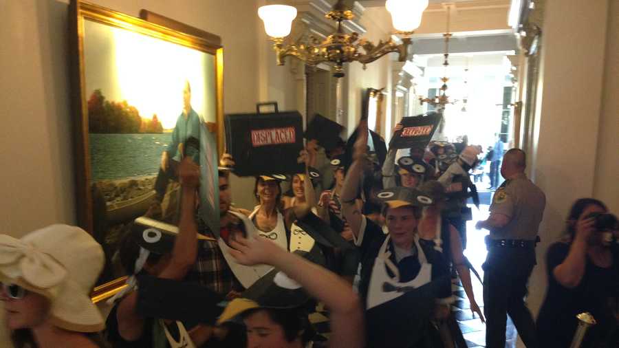 Members of the group Rising Tide stage a raucous protest at the Statehouse Monday, disrupting some hearings inside. The group is unhappy with Gov. Peter Shumlin for supporting budget cuts and a new natural gas pipeline. 