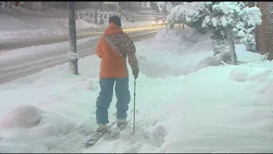 Adam Newhard ditches his car and put on his skis to travel through Burlington.