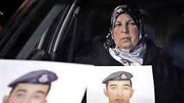 Photograph of slain Jordanian pilot, held by his mother