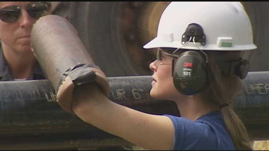 A Plainfield woman disrupted work on the Vermont Gas pipeline project Thursday when she locked herself to a mammoth steel pipe.