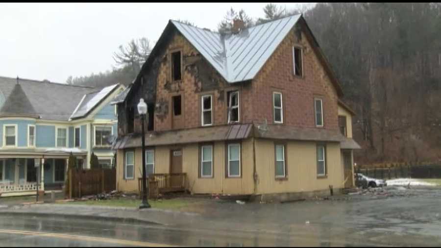 The Maple Street building was home to four families before a fire ripped through it Tuesday night, injuring one tenant and displacing all twelve that lived there.