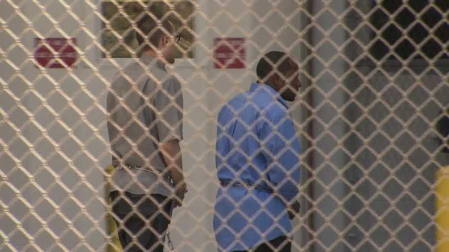 Ken Konias Jr. in handcuffs (left)