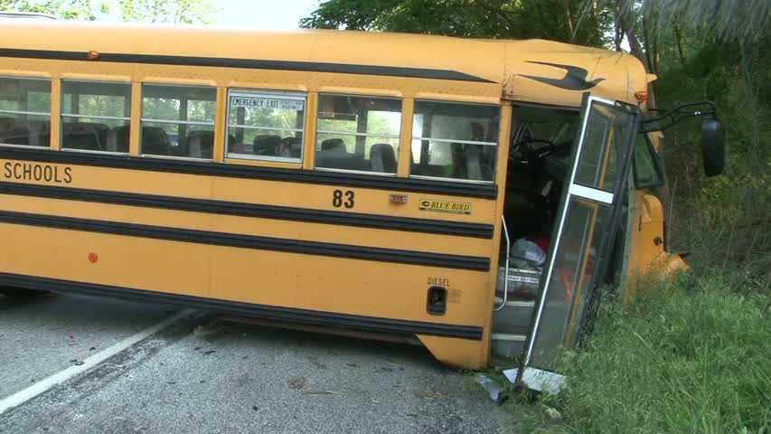 School bus in crash with tractor-trailer