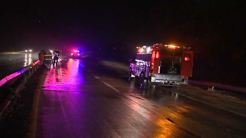 Ambulance flips on side in rainy crash