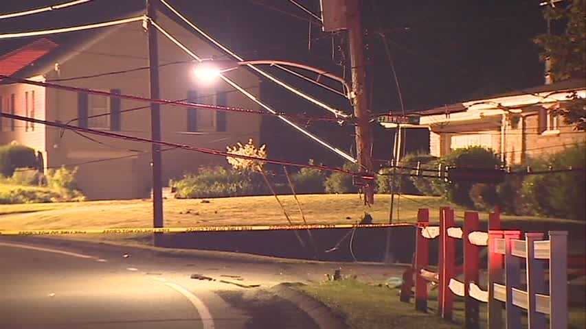 Car crashes into pole, splits in half