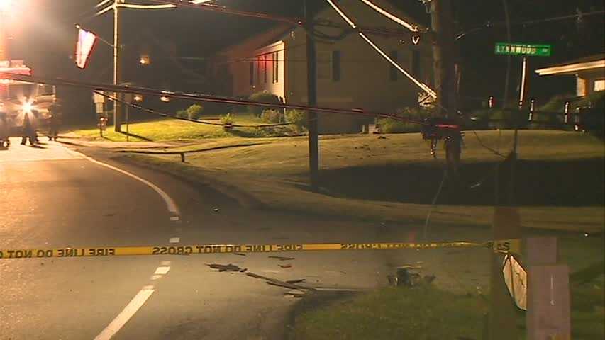 Car crashes into pole, splits in half