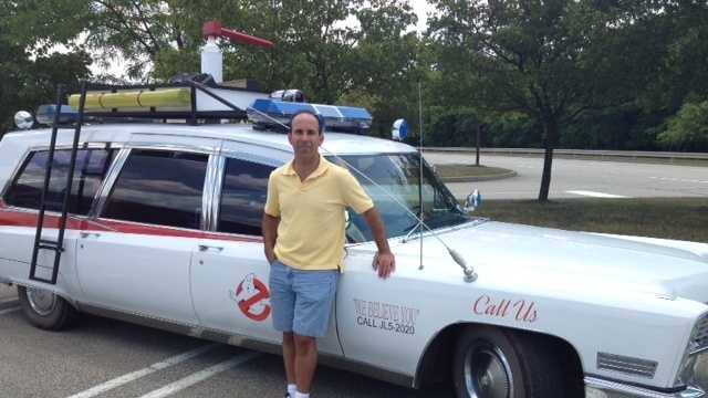 Bob Shapiro poses for a photo with his very own Ecto-1