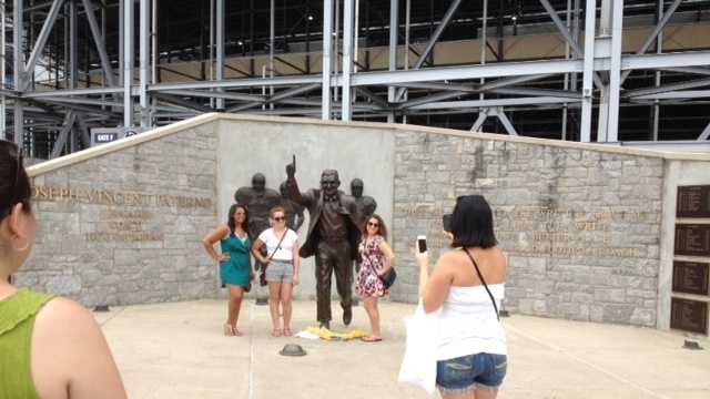 Penn State fans take photos at the Joe Paterno statue outside Beaver Stadium.