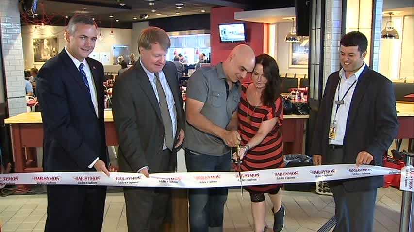 Celebrity chef Michael Symon celebrated the grand opening of his new restaurant at Pittsburgh International Airport.