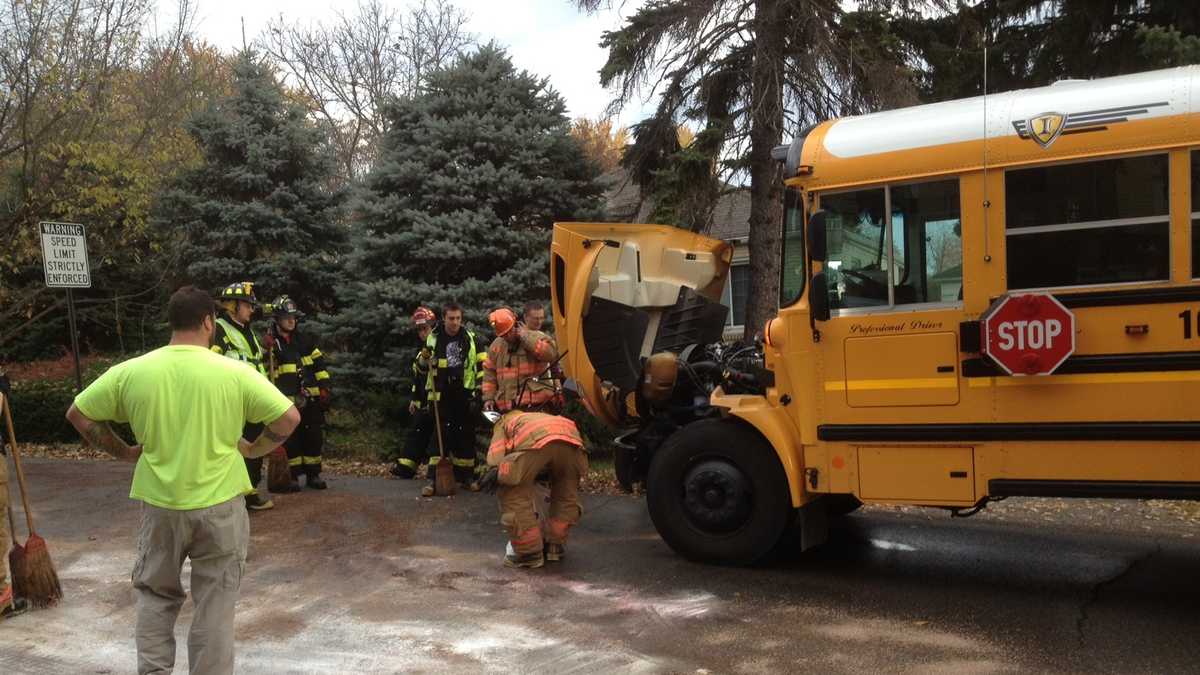 Car collides head-on with school bus carrying students