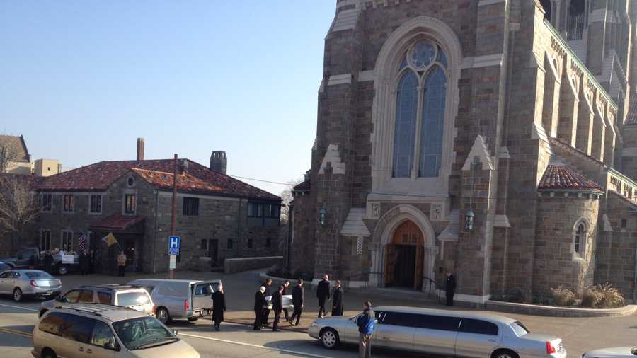 Pallbearers carried the small casket into the church.