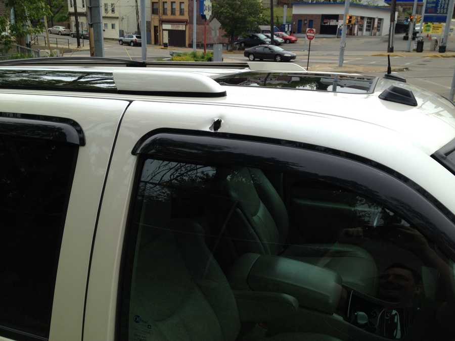 Photos: Off-duty officer finds bullet holes in Cadillac Escalade