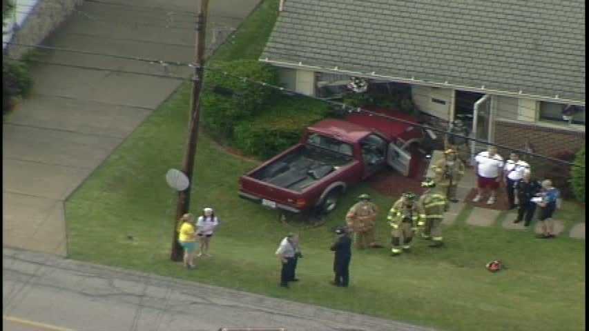 Photos: Pickup truck slams into Ross Township home