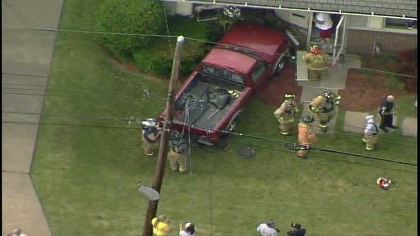 Photos: Pickup truck slams into Ross Township home