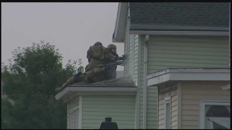 A standoff with a heavily armed state police team lasts all night and continues into the early afternoon until shots are fired and the home is rushed.