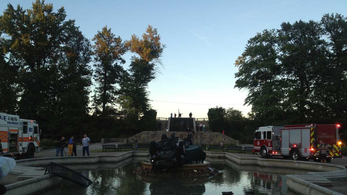 Photos Car lands in fountain at Highland Park