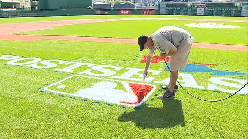 A Major League Baseball postseason logo is painted on the grass at PNC Park for the first time ever, as the ballpark prepares to host the NL Wild Card Game.