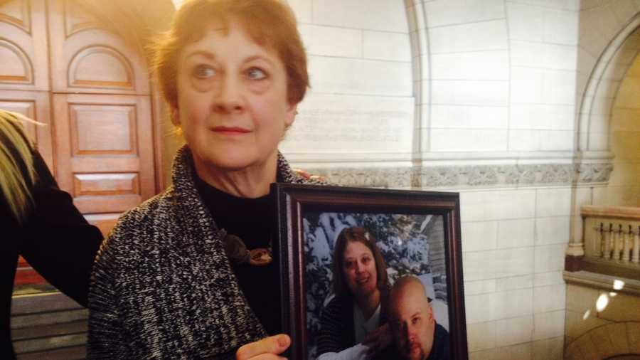 Ann Haines holds a picture of her son, Michael, and his sister.