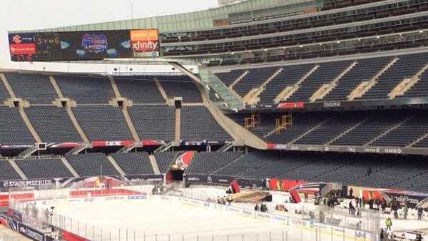 A hockey rink is set up inside Soldier Field in Chicago for the Penguins-Blackhawks game in the NHL Stadium Series.