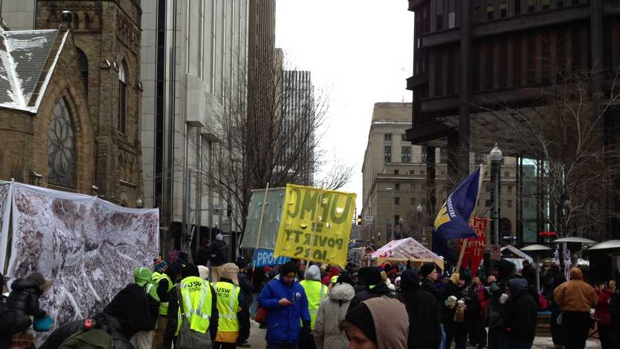 An estimated 300 workers and bused-in labor activists tied up Pittsburgh traffic when they marched downtown to rally outside the corporate offices of UPMC.