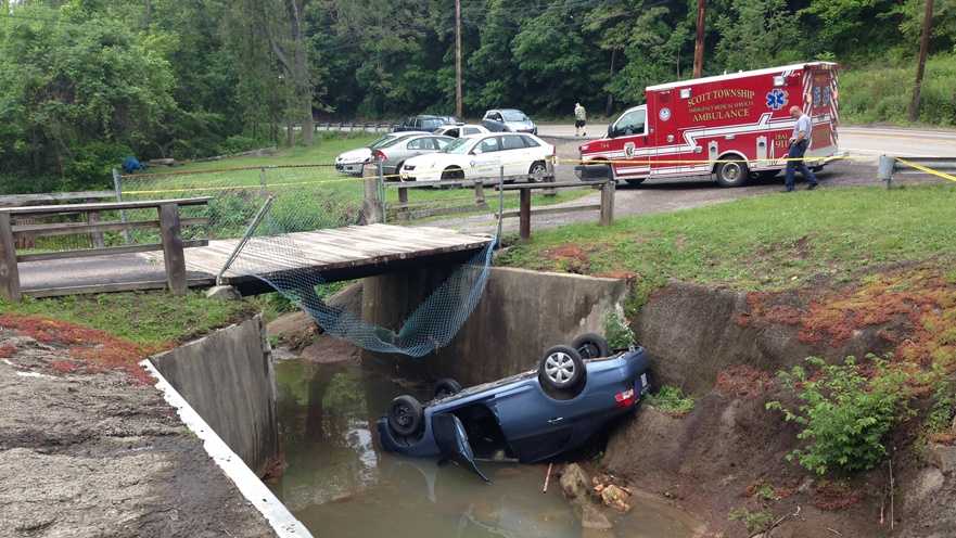 Driver pronounced dead after car lands on roof in creek