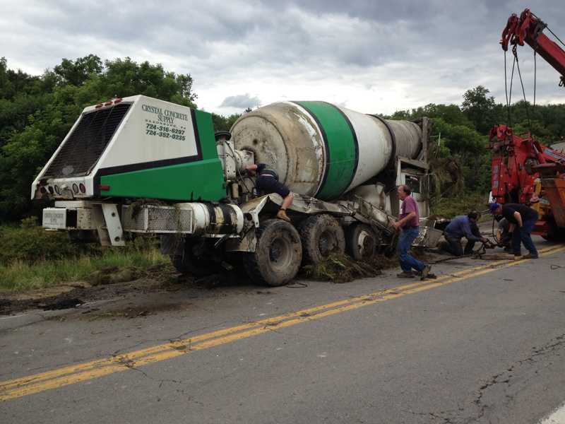Photos Cement truck crashes over side of Route 228