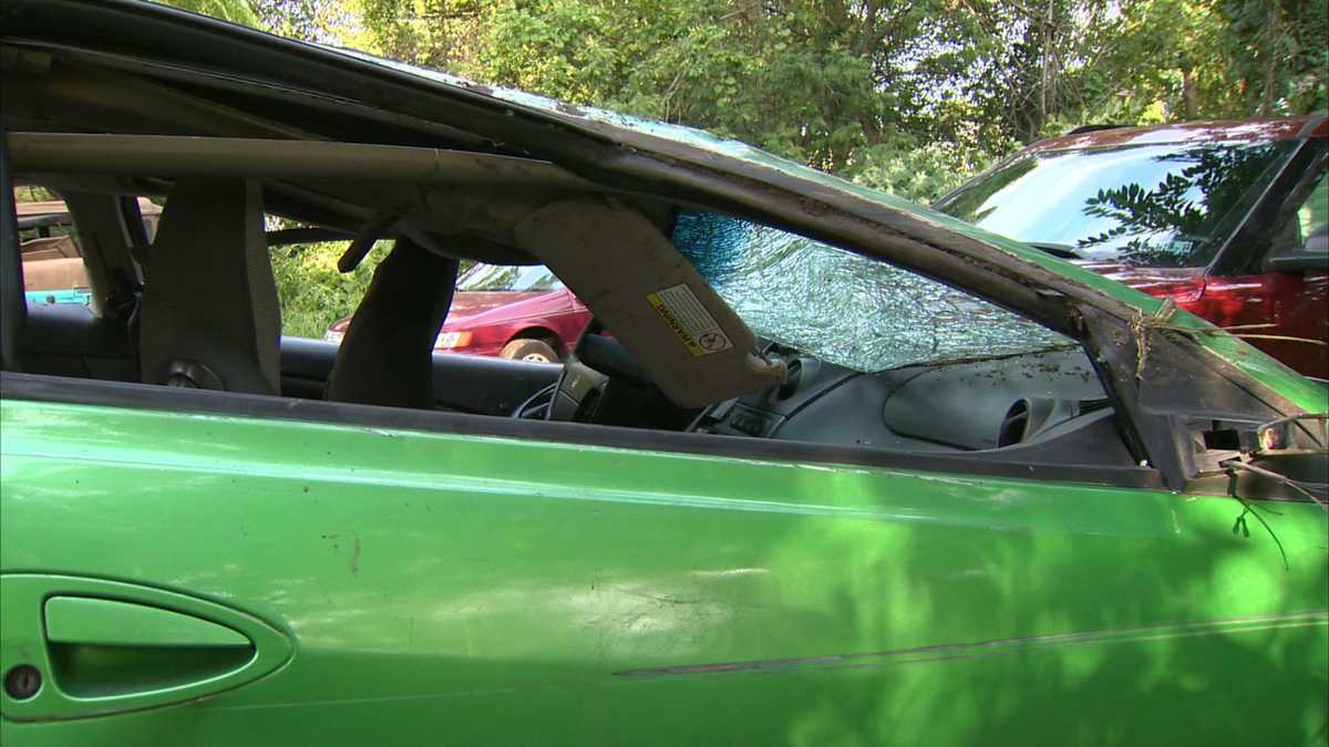 Photos: Woman crawls out of car after crash down hillside