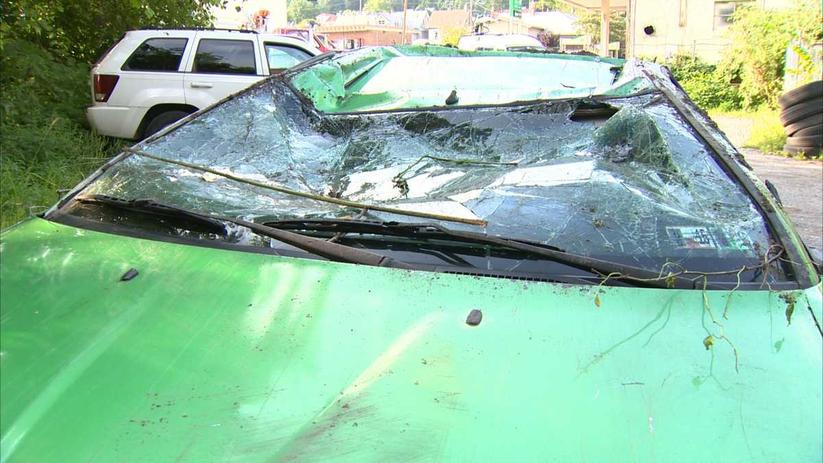 Photos: Woman crawls out of car after crash down hillside