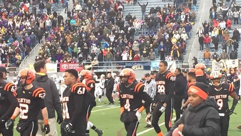 The Clairton High School football team walks off the field after a tough loss to Bishop Guilfoyle in the PIAA state championship game in Hershey.
