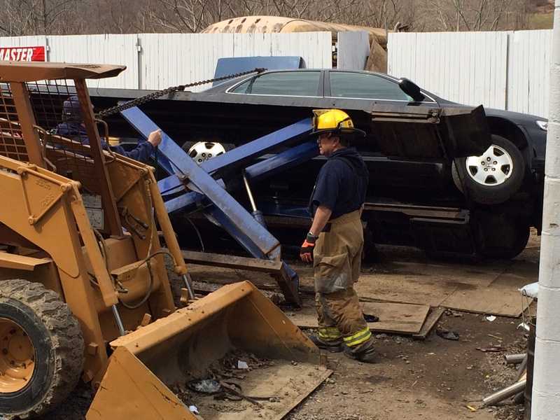 Photos: Vehicle falls off lift at Butler County garage