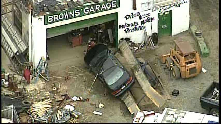 Photos: Vehicle falls off lift at Butler County garage