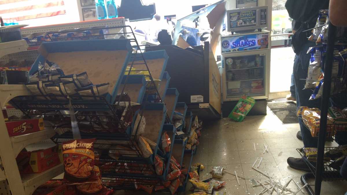 Photos: Car hits store at Rankin Bridge intersection