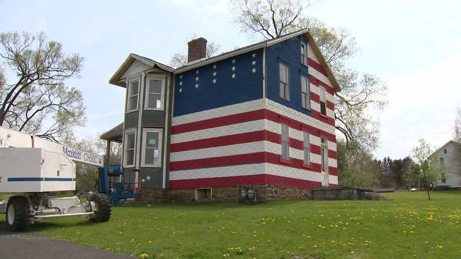 A married couple's rental property in Youngstown, Westmoreland County, is painted red, white and blue to show support for presidential candidate Donald Trump.