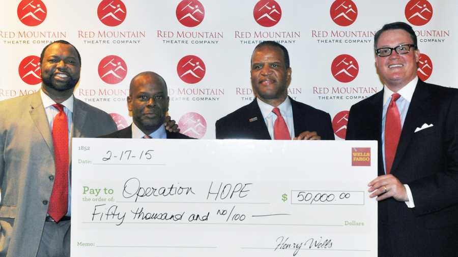 Left to right: Jay Bailey, Operation HOPE Southeast region CEO; Richard Busby, Wells Fargo senior community development officer; John Hope Bryant, Operation HOPE founder, chairman and CEO; and George Trible, Wells Fargo area president.  On Tuesday, Wells Fargo presented Operation HOPE with $50,000 to bring a Small Business Empowerment Program to Birmingham.