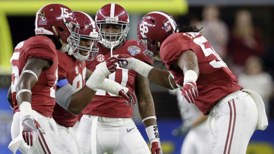After sacking Michigan State quarterback Connor Cook, Alabama defensive lineman Jonathan Allen (93) celebrates with teammates Ronnie Harrison (15), Reuben Foster (10) and Tim Williams (56) during the first half of the Cotton Bowl NCAA college football semifinal playoff game, Thursday, Dec. 31, 2015, in Arlington, Texas.