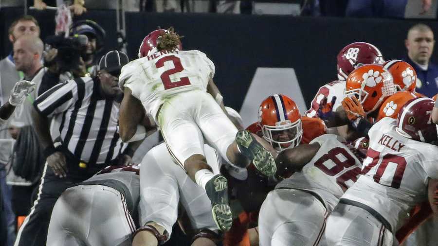 Alabama's Derrick Henry (2) dives into the end zone for a touchdown during the first half of the NCAA college football playoff championship game against Clemson Monday, Jan. 11, 2016, in Glendale, Ariz.