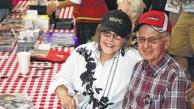 7. Also born in Mount Airy, Grammy Award winner Donna Fargo. In this photo, she poses with Cliff Shockley during an autograph signing session. (Photo from Mt. Airy News website)