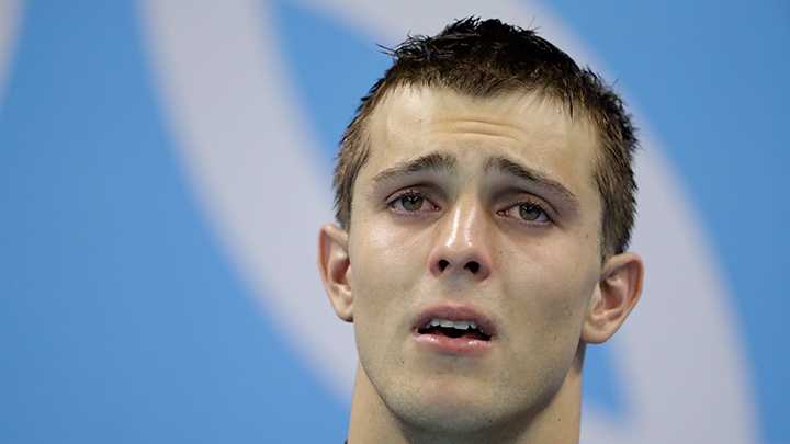 North Carolina State swimmer Ryan Held cried on the medal podium after winning gold in the 4x100m relay at his Olympics debut in Rio.