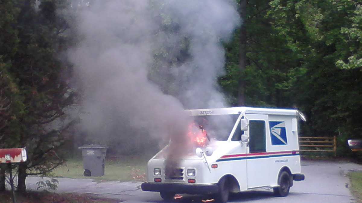 Mail truck catches fire