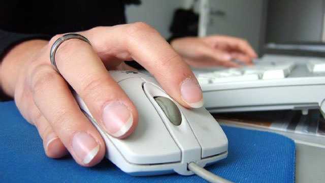 woman using computer mouse