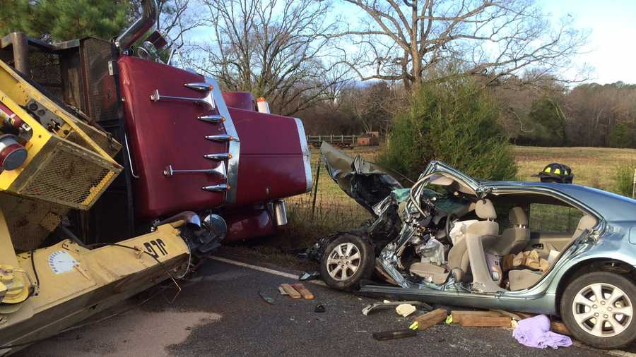 This wreck between a flatbed truck hauling a crane and a Toyota Camry is under investigation.