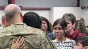Michael Haley hugs his wife as his children look on before his deployment last January.